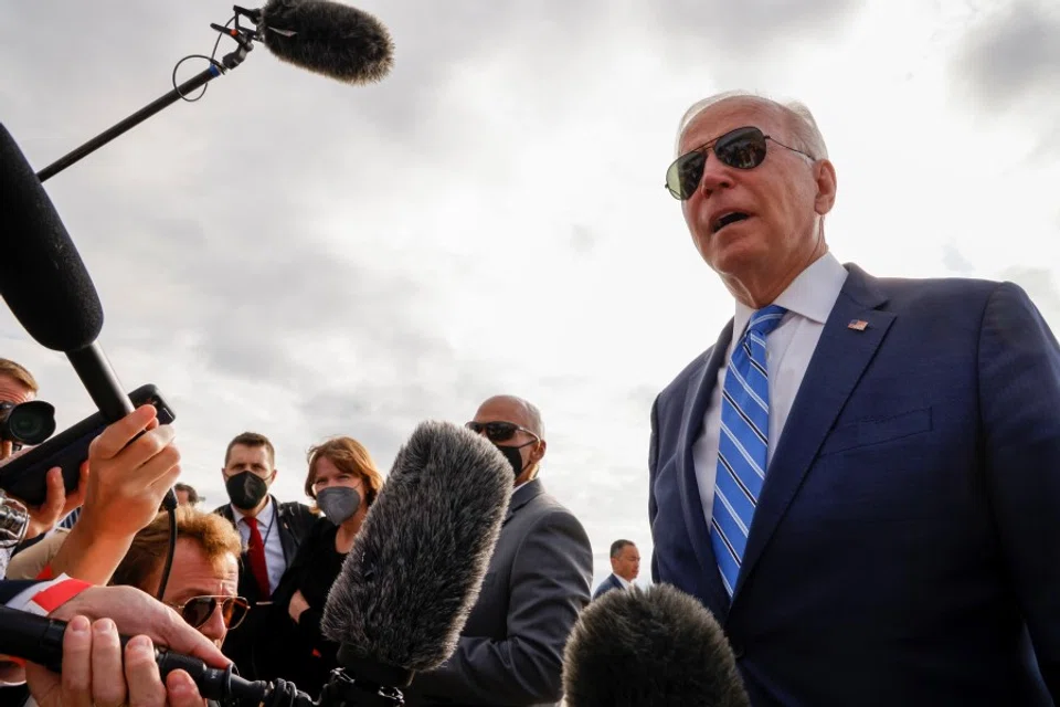 US President Joe Biden speaks to reporters before boarding Air Force One to depart Capital Region International Airport in Lansing, Michigan, US, 5 October 2021. (Jonathan Ernst/Reuters)