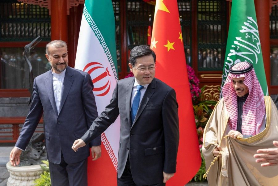 Iranian Foreign Minister Hossein Amir-Abdollahian, Chinese Foreign Minister Qin Gang and Saudi Arabia's Foreign Minister Prince Faisal bin Farhan Al Saud during their meeting in Beijing, China, 6 April 2023. (Saudi Press Agency/Handout via Reuters)