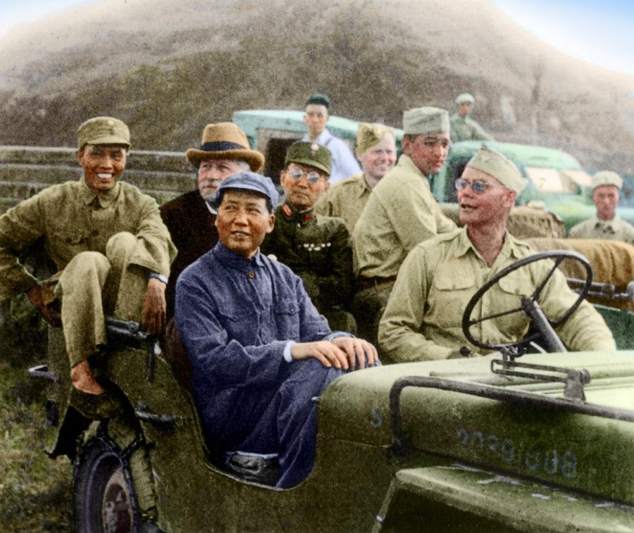 Chinese Communist Party (CCP) leader Mao Zedong and US ambassador to China Patrick J. Hurley (back row) in an American army jeep.