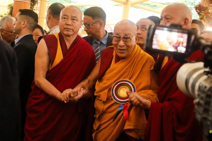 Tibetan spiritual leader the Dalai Lama (right) arrives to attend a Long Life Prayer offering ceremony at the Main Tibetan Temple in McLeod Ganj, near Dharamsala on 30 June 2025.