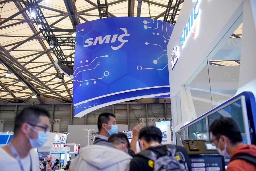 People visit a booth of Semiconductor Manufacturing International Corporation (SMIC), at China International Semiconductor Expo (IC China 2020) following the Covid-19 outbreak in Shanghai, China, 14 October 2020. (Aly Song/File Photo/Reuters)