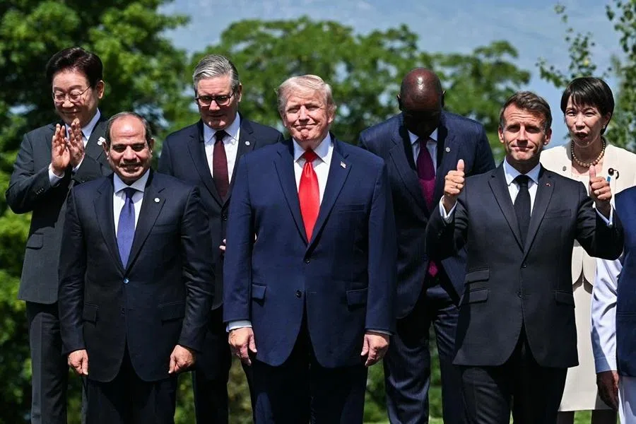 (from left) South Korea's President Lee Jae-myung, Egypt's President Abdel Fattah El-Sisi, Britain's Prime Minister Keir Starmer, US President Donald Trump, Kenya's President William Ruto, France's President Emmanuel Macron and Japan's Prime Minister Sanae Takaichi pose for a family photograph during the G7 summit, in Evian, France, 16 June 2026.