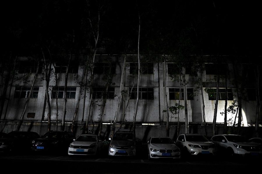 This picture shows a building of an industrial park in Houjie, in Dongguan, Guangdong province, China, on 30 September 2021, an area hit by power restrictions. (Noel Celis/AFP)