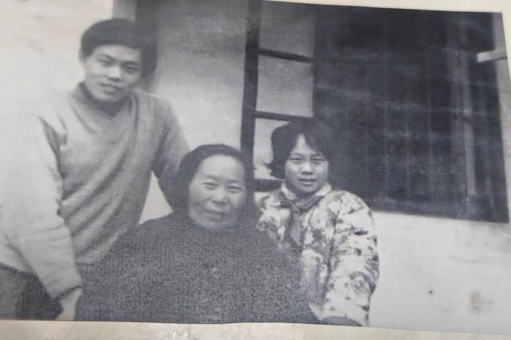 A photo of the author’s father and grandmother posing in front of their house. (Photo provided by the author’s parents)