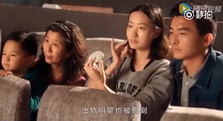 A screen grab from the video for Song of the Chaoyang Public. The Chinese caption reads: "Straying celebrities are also caught." (Screen grab/Miaopai)