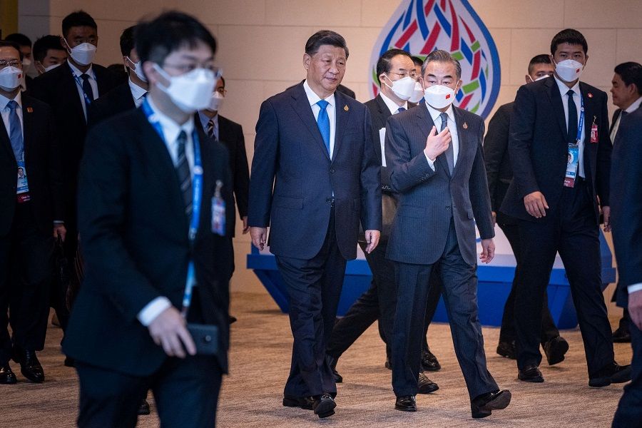 Chinese President Xi Jinping, along with Chinese Foreign Minister Wang Yi, arrives at Queen Sirikit National Convention Center in Bangkok, Thailand, on 19 November 2022 for the Asia-Pacific Economic Cooperation (APEC) summit. (Haiyun Jiang/Pool via Reuters)
