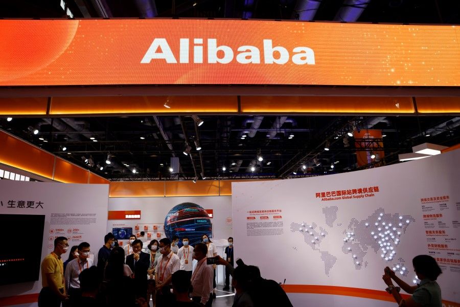 People visit the Alibaba booth during the 2021 China International Fair for Trade in Services (CIFTIS) in Beijing, China, 4 September 2021. (Florence Lo/Reuters)