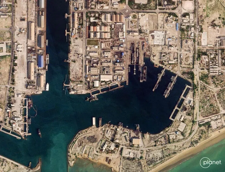 This handout satellite image taken by 2026 Planet Labs PBC shows damage at the military harbour in Iran’s southern port of Bandar Abbas along the Strait of Hormuz on 4 March 2026. (2026 Planet Labs PBC/AFP)
