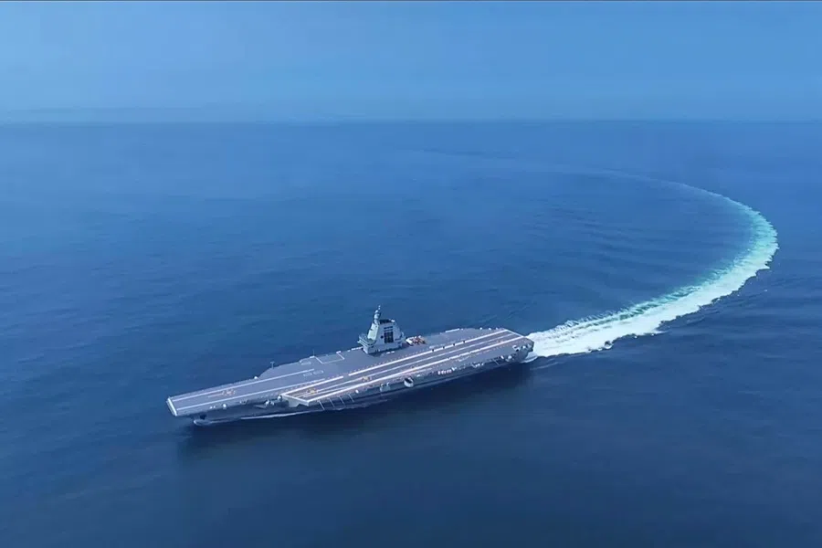 This screen grab from video footage from China's Ministry of Defence taken in May 2024 and released via AFPTV on 11 May 2024 shows China's third aircraft carrier Fujian carrying out sea trials at sea in an unknown location. (China’s Ministry of Defence/Handout via AFP)
