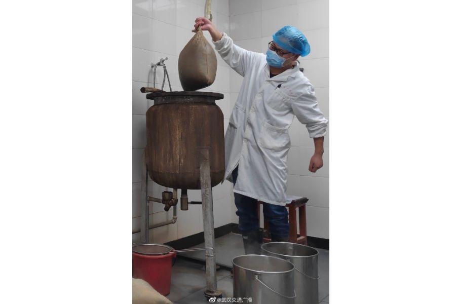 Traditional Chinese medicine practitioner brewing large volumes of medicine on a daily basis.
