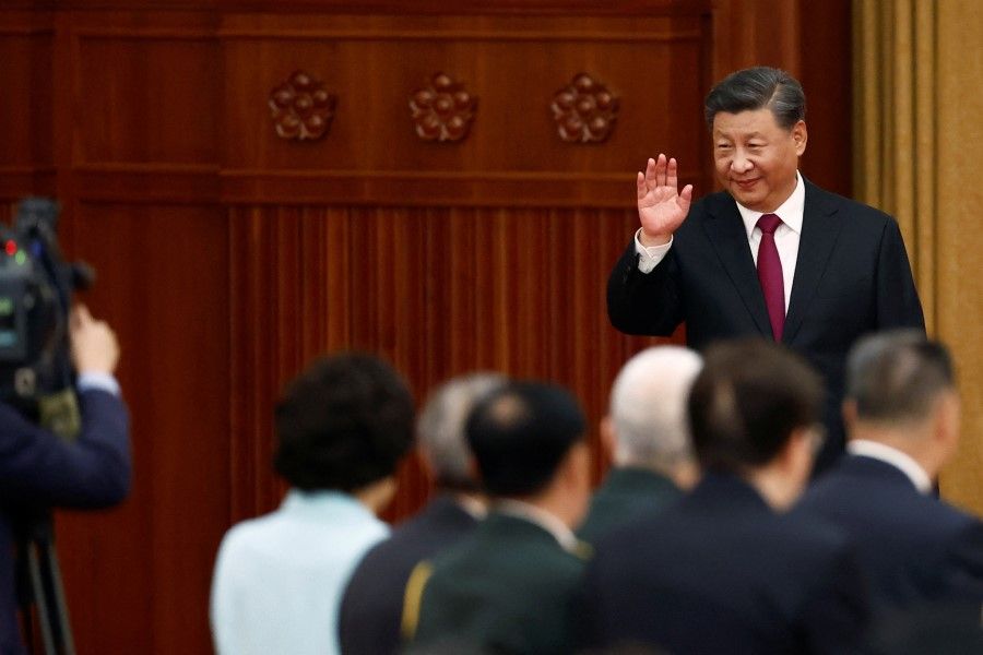 Chinese President Xi Jinping waves as he arrives for a reception at the Great Hall of the People on the eve of the Chinese National Day in Beijing, China, 30 September 2022. (Florence Lo/Reuters)