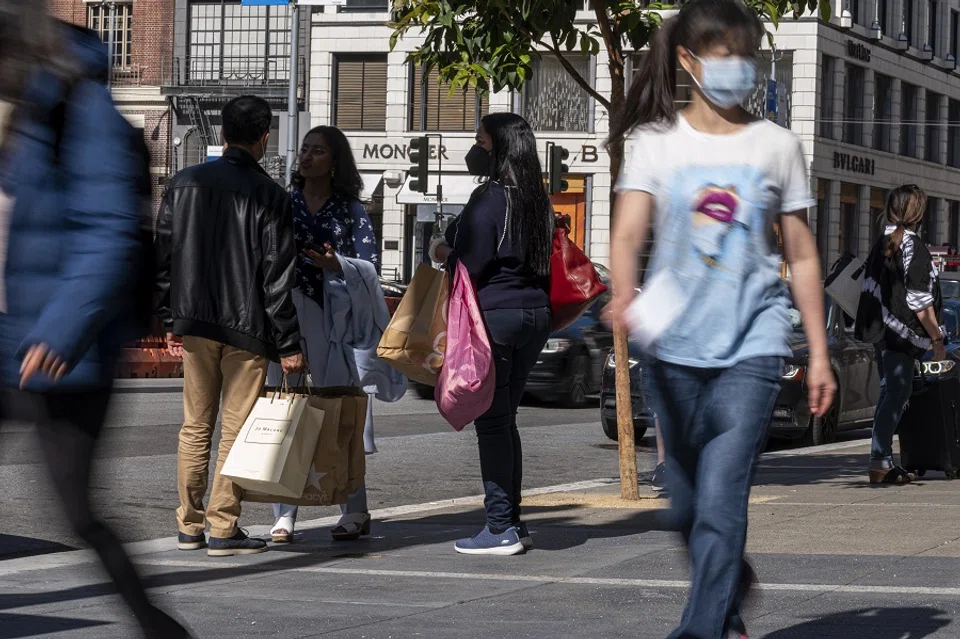 Pedestrians carry shopping bags on Geary street in San Francisco, California, US, on 18 May 2022. (David Paul Morris/Bloomberg)