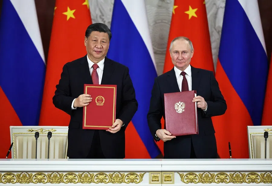 Russian President Vladimir Putin and Chinese President Xi Jinping attend a signing ceremony following their talks at the Kremlin in Moscow, Russia, 21 March 2023. (Sputnik/Mikhail Tereshchenko/Pool via Reuters)