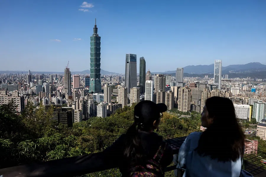 Visitors look around Taipei city from the top of Elephant Mountain in Taipei on 29 November 2024. (I-Hwa Cheng/AFP)