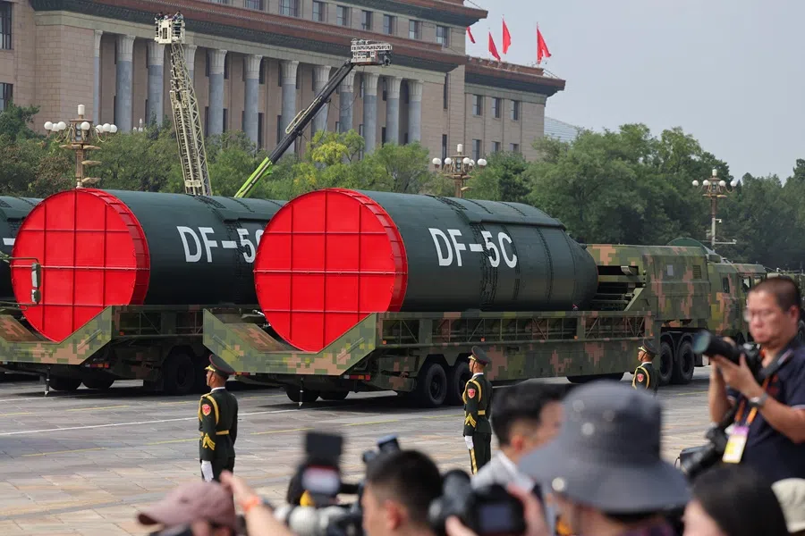 Members of the People’s Liberation Army stand as the strategic strike group displays DF-5C missiles during a military parade to mark the 80th anniversary of the end of World War Two, in Beijing, China, on 3 September 2025. (Maxim Shemetov/Reuters)