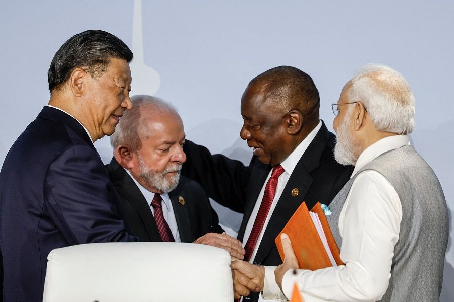 From left: President of China Xi Jinping, President of Brazil Luiz Inacio Lula da Silva, South African President Cyril Ramaphosa and Prime Minister of India Narendra Modi gesture during the 2023 BRICS Summit in Johannesburg, South Africa, on 24 August 2023. (Marco Longari/AFP)