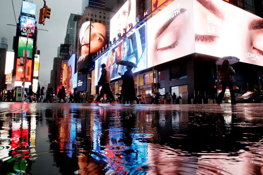 People walk through Times Square in New York City on 18 January 2025. (Leonardo Munoz/AFP)