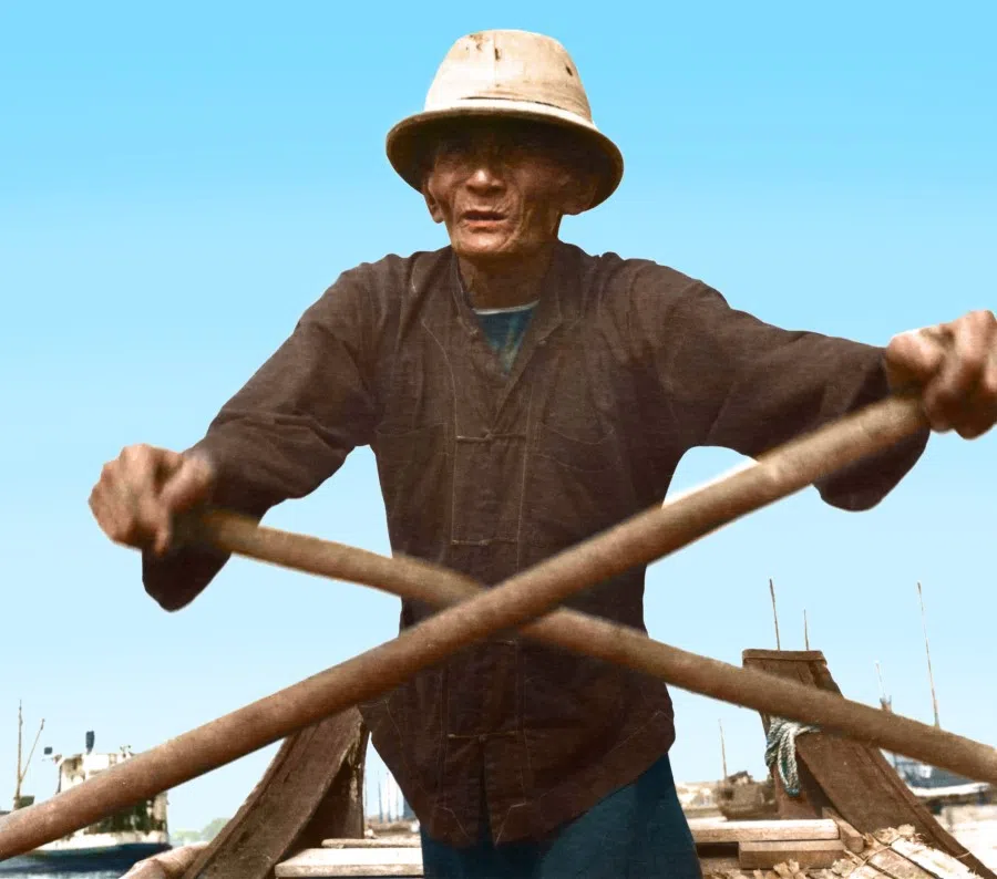 An old fisherman rowing in Singapore, 1950s. Residents of fishing villages or kelongs were mostly Malays, but some Chinese also fished, and this was passed down through generations.
