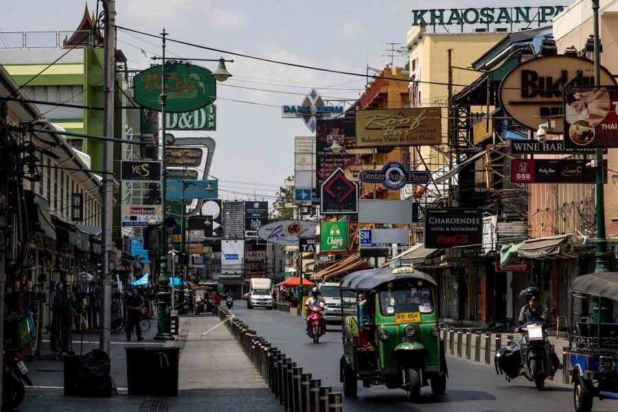 A tuk tuk drives down Khao San Road, a once popular tourist strip in Bangkok on 15 February 2021, as Thailand records it worst economic performance in more than two decades. (Jack Taylor/AFP)