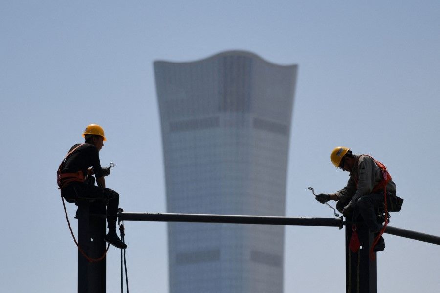In this photo, the China Zun, the tallest building in Beijing, is seen in the background on 8 May 2021. (Greg Baker/AFP)
