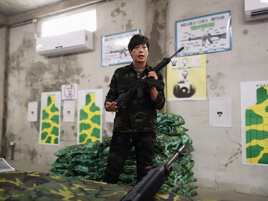 Learning to use rifles at the Houlin Military Base.