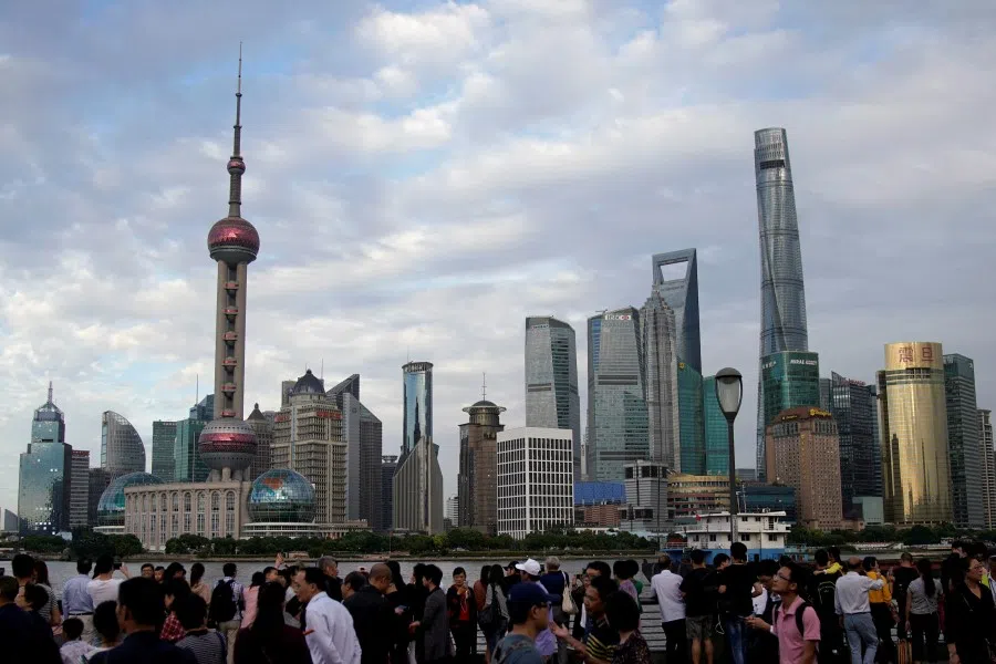 People visit the Bund in front of Shanghai's financial district of Pudong in Shanghai, China, on 28 September 2017. (Aly Song/Reuters)