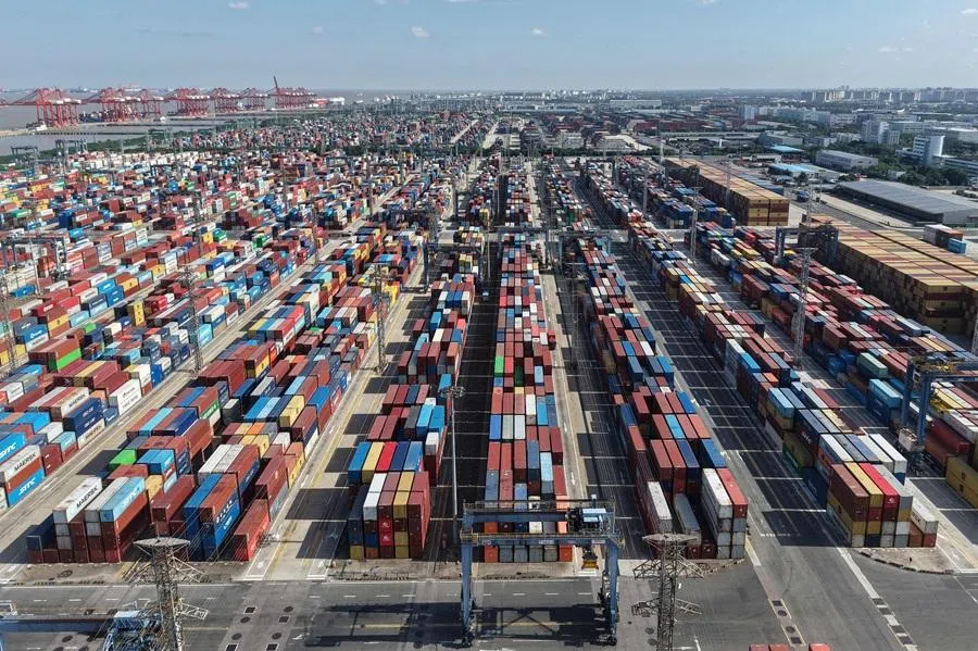 An aerial view shows shipping containers at the Shanghai Port container terminal in Shanghai on 8 January 2026.