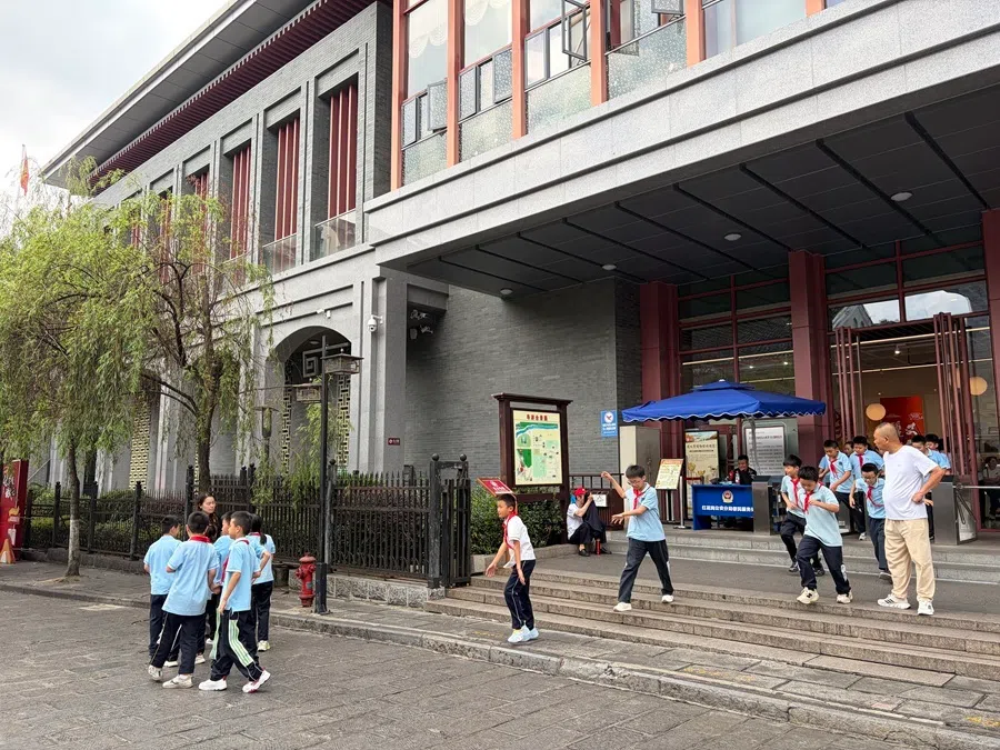 Students come out of the exhibition area at Zunyi, 22 September 2026.