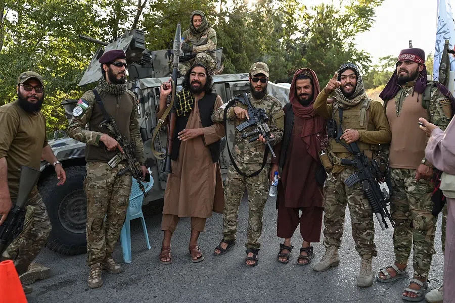 Taliban security personnel pose for photo as they celebrate the third anniversary of the Taliban takeover of Afghanistan at the Wazir Akbar Khan hilltop in Kabul on 14 August 2024. (Wakil Kohsar/AFP)