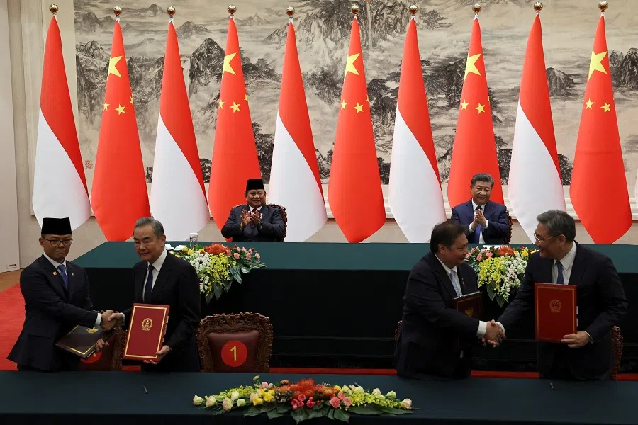 Chinese President Xi Jinping and Indonesian President Prabowo Subianto applaud during a signing ceremony at the Great Hall of the People in Beijing, China, on 9 November 2024. (Florence Lo/Reuters)