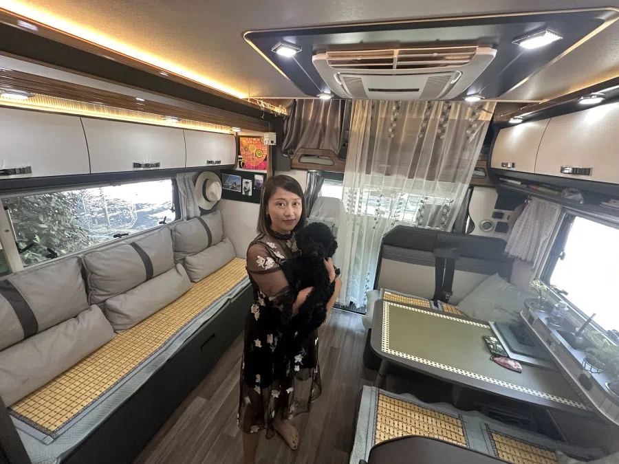 Shen Lan lives in an RV with her poodle.