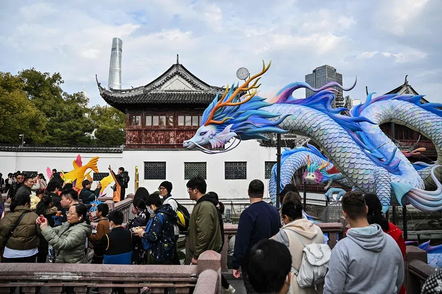 People visit the Yu Garden in Shanghai, China, on 13 February 2024. (Hector Retamal/AFP)