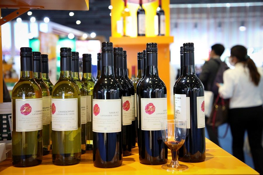 Wines from Australia are seen at the Food and Agricultural Products exhibition at the third China International Import Expo (CIIE) in Shanghai on 5 November 2020. (STR/AFP)