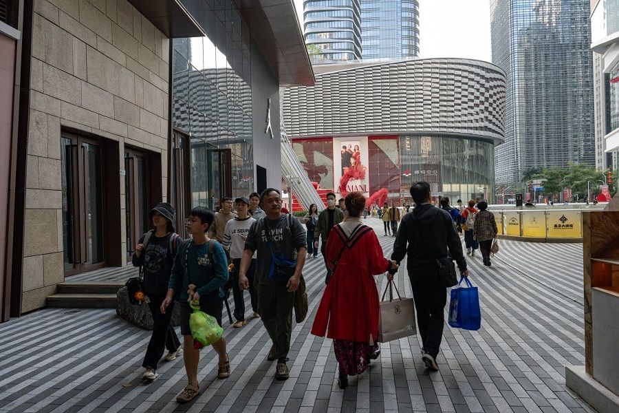Shoppers in Shenzhen, China, on 13 February 2024. (Gilles Sabrie/Bloomberg)