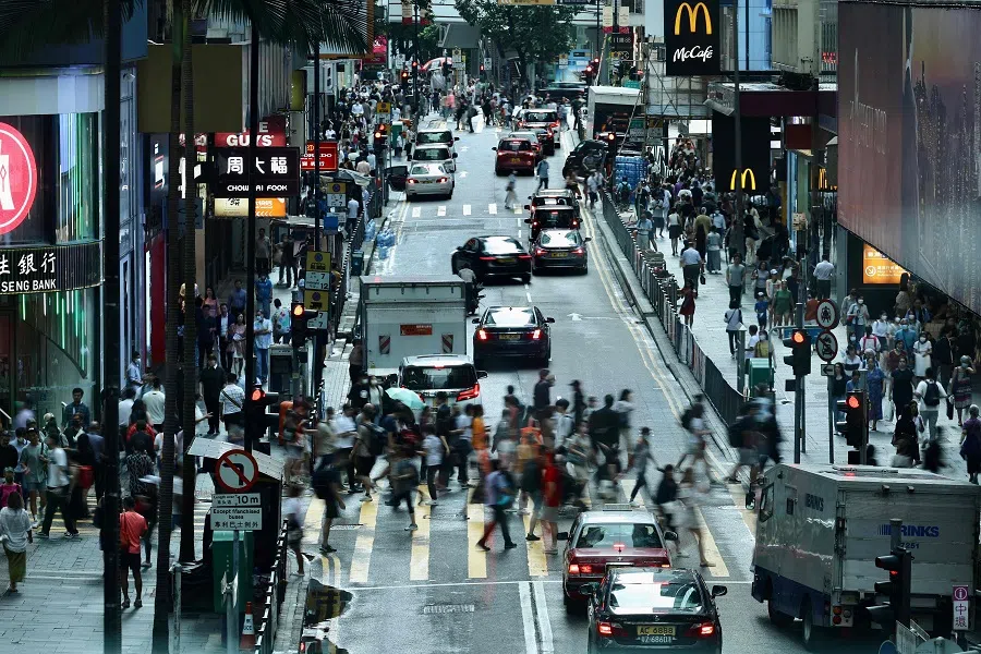 People in Central, a financial hub in Hong Kong, China, on 3 July 2023. (May James/AFP)