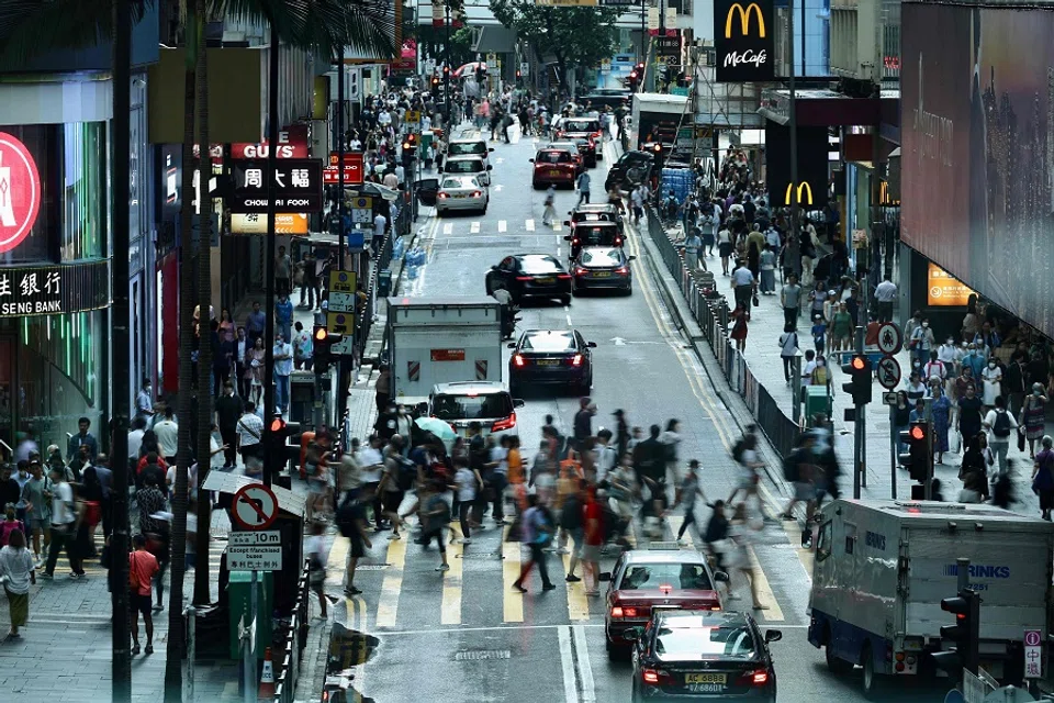 People in Central, a financial hub in Hong Kong, China, on 3 July 2023. (May James/AFP)