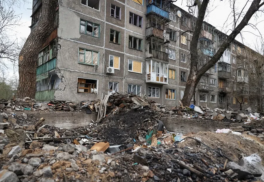 A view shows a residential building damaged by shelling in the town of Chasiv Yar, amid Russia's attack on Ukraine, near a front line in Donetsk region, Ukraine, 22 April 2023. (Sofiia Gatilova/Reuters)