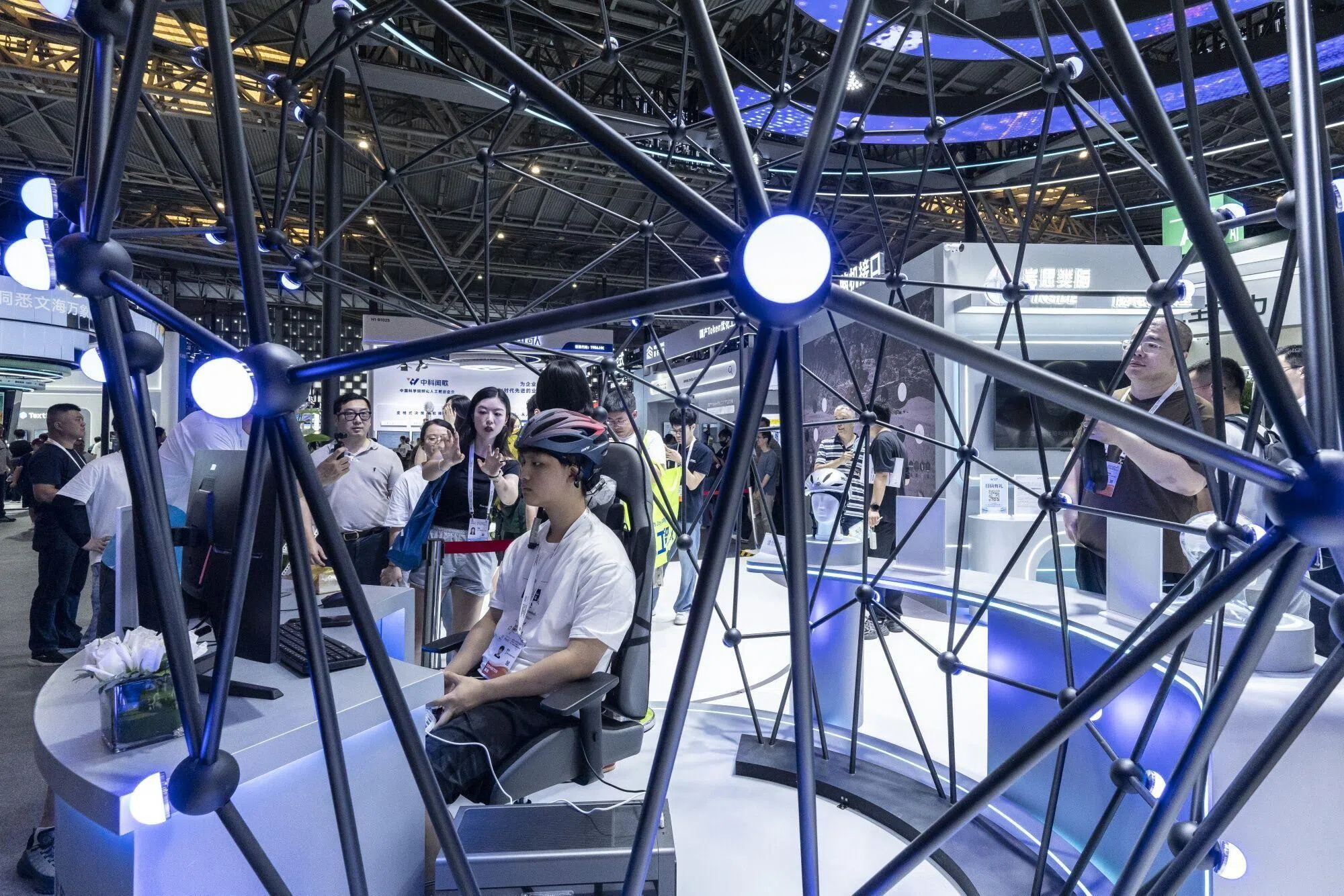 A visitor wears a Stonehill Technology Ltd.'s helmet-style brain-computer interface (BCI) at the World AI Conference (WAIC) in Shanghai, China, on 17 July 2026.