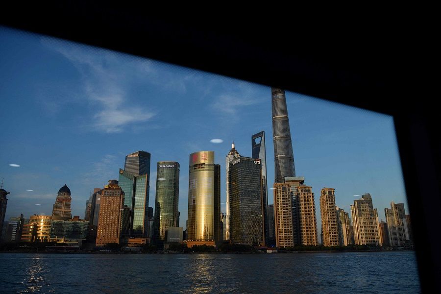 The Lujiazui financial district is seen from a ferry on the Huangpu River in Shanghai, China, on 30 August 2021. (Greg Baker/AFP)