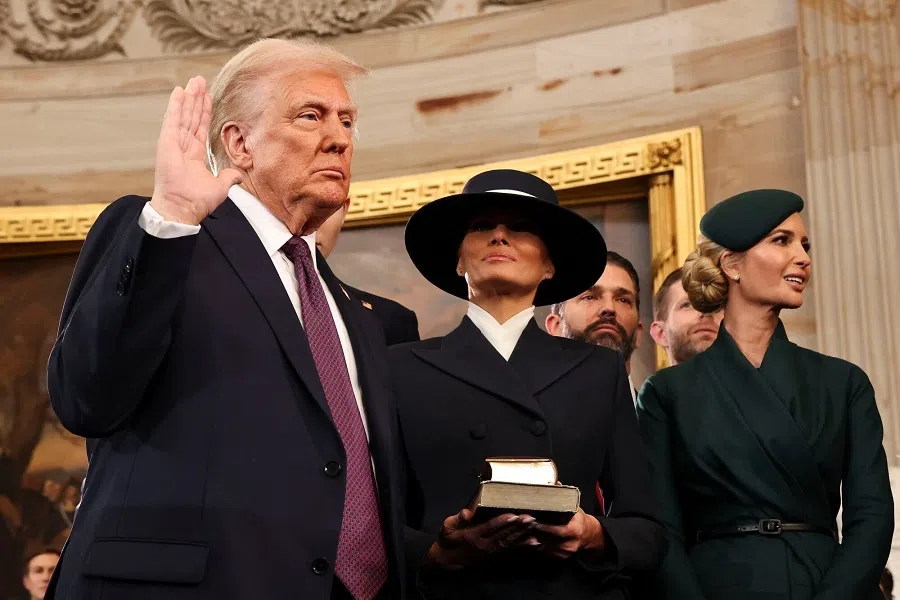 US President Donald Trump takes the oath of office during the 60th presidential inauguration in the rotunda of the US Capitol in Washington, DC, US, on 20 January 2025. ( Chip Somodevilla/Bloomberg)