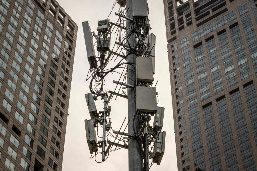 A cellphone tower, used for 5G network, is seen on a street in Beijing, April 7, 2020. (Nicolas Asfouri/AFP)