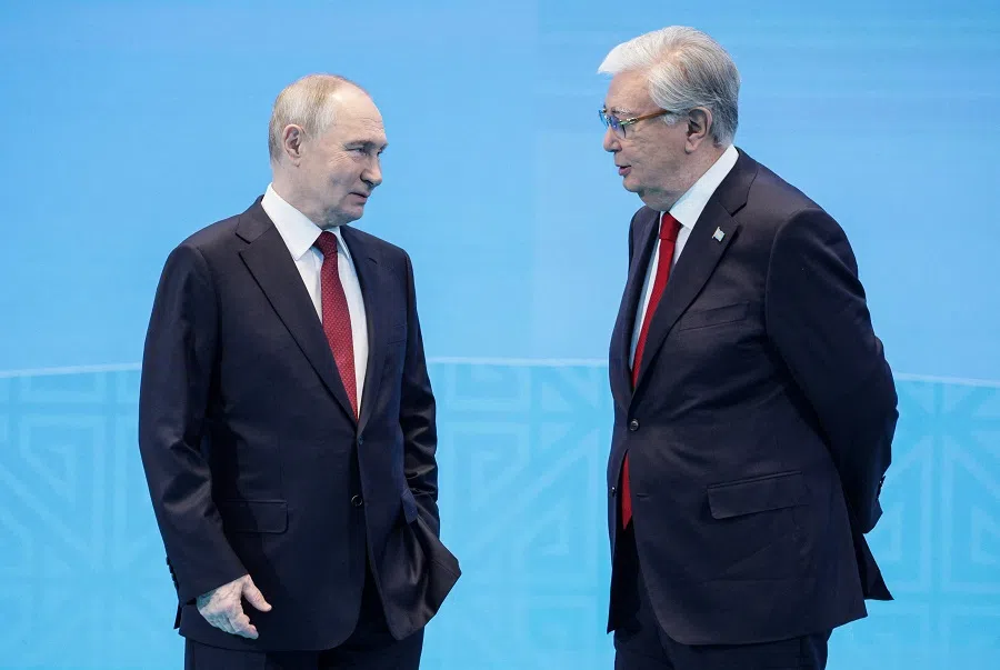In this pool photograph distributed by the Russian state agency Sputnik, President of Kazakhstan Kassym-Jomart Tokayev (right) stands with Russian President Vladimir Putin amid a meeting of the Collective Security Treaty Organization (CSTO) in Astana on 28 November 2024.