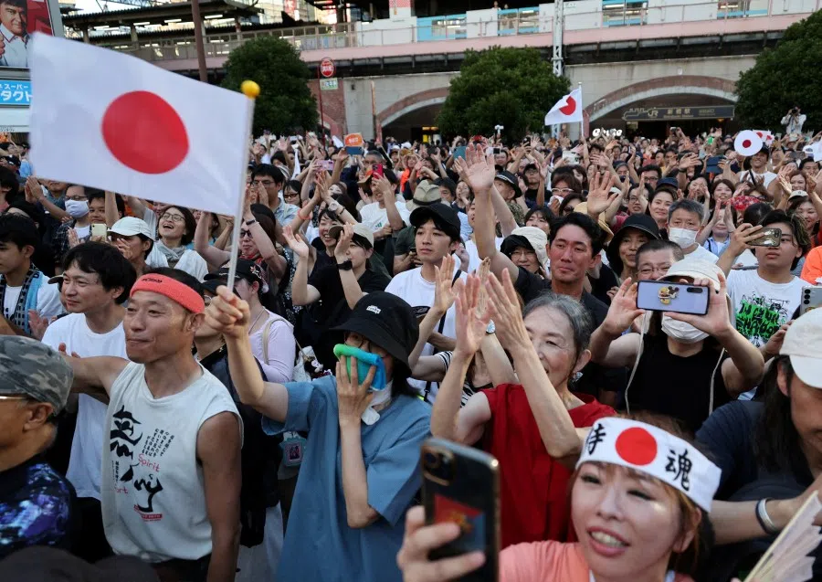 Supporters of Japan’s Sanseito party leader react during the party’s rally in Tokyo, Japan, on 21 July 2025, a day after the upper house election. (Kim Kyung-Hoon/Reuters)