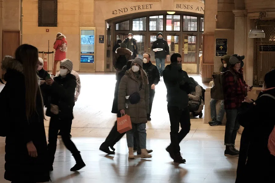 People walk through Grand Central Terminal in Manhattan on 21 January 2022 in New York City, US. (Spencer Platt/Getty Images/AFP)