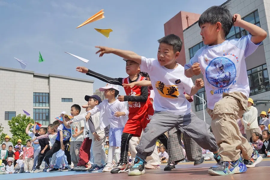Children fly paper airplanes at the Second Experimental Kindergarten in Yantai High-tech Zone, Shandong province, China, on 29 May 2024.