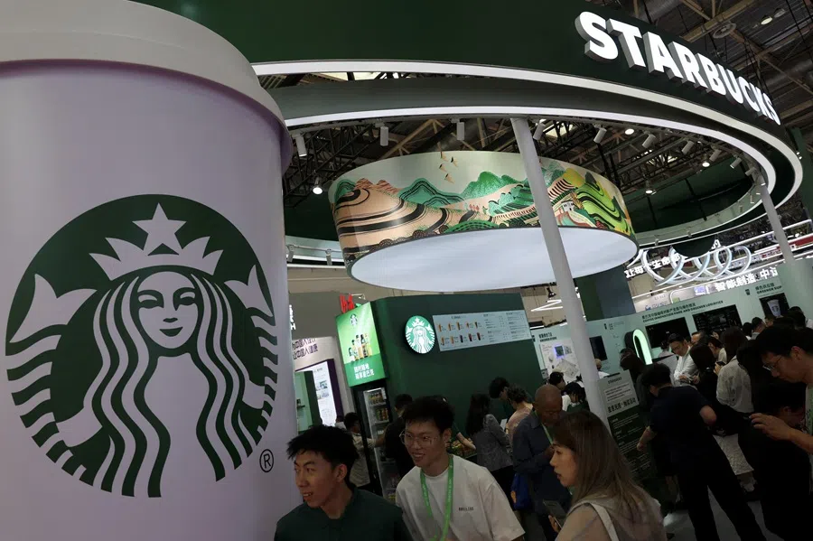 People visit the Starbucks booth during the China International Supply Chain Expo in Beijing, China, 16 July 2025.