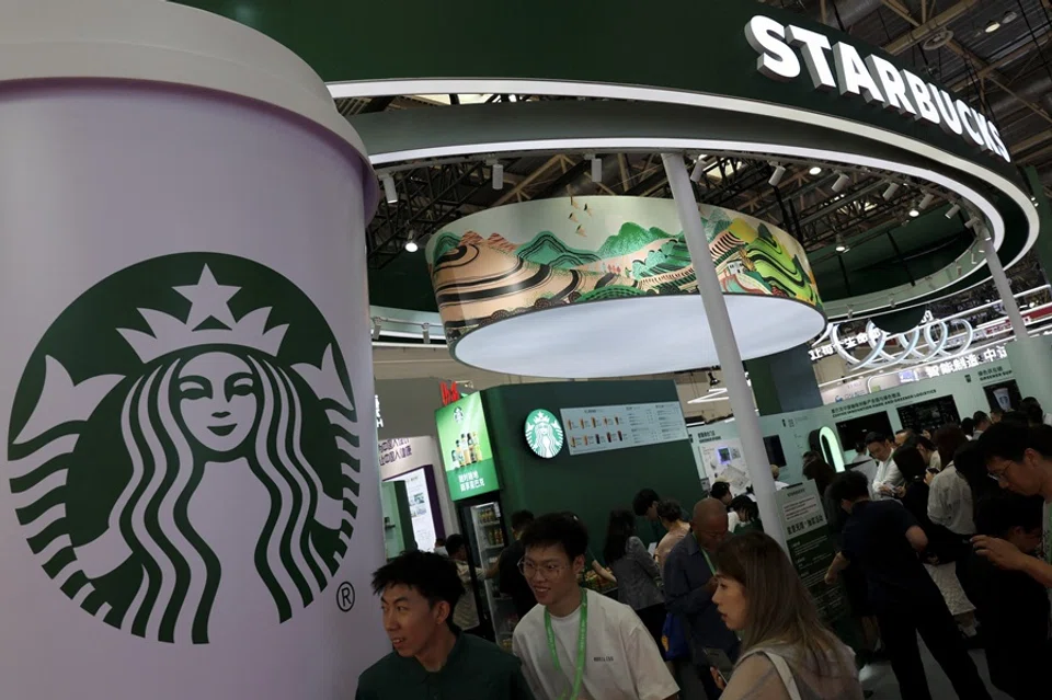 People visit the Starbucks booth during the China International Supply Chain Expo in Beijing, China, 16 July 2025. (Florence Lo/Reuters)