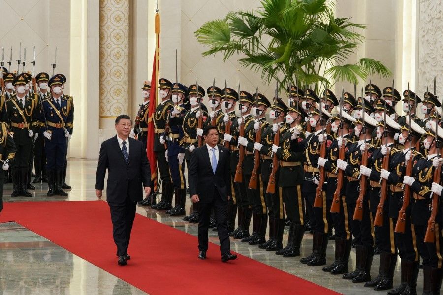 China's President Xi Jinping walks with Philippines' President Ferdinand "Bongbong" Marcos Jr during a welcoming ceremony at the Great Hall of the People in Beijing, China, 4 January 2023. (Office of the Press Secretary/Handout via Reuters)