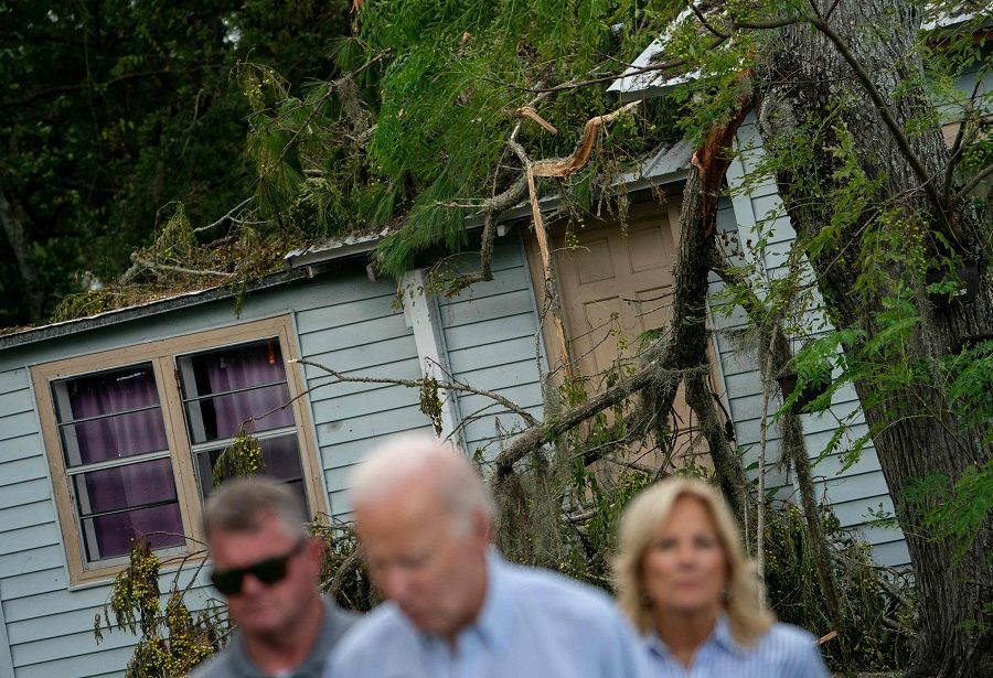 US President Joe Biden speaks in front of a home destroyed by fallen trees and debris during a tour of communities impacted by Hurricane Idalia, in Live Oak, Florida, US on 2 September 2023. (Stefani Reynolds/AFP)