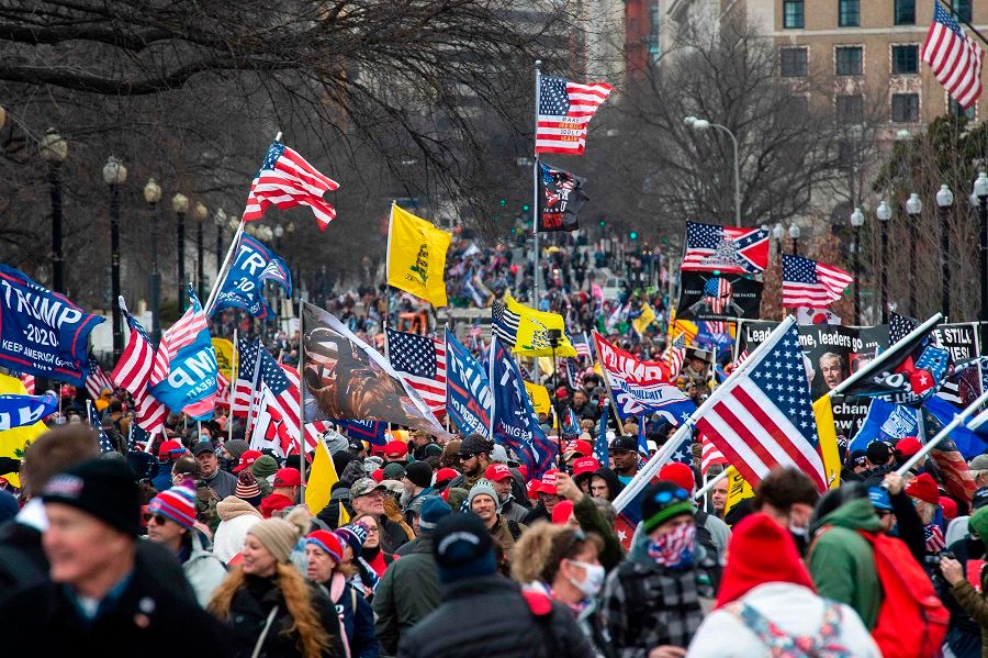 Thousands of supporters of US President Donald Trump march through the streets of the city as they make their way to the Capitol Building in Washington, DC on 6 January 2021. (Joseph Prezioso/AFP)